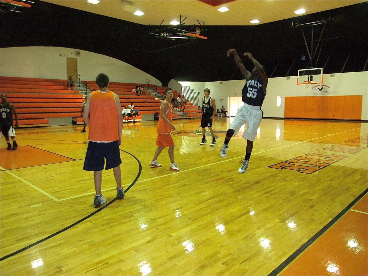 Image: Gotta take it to make it — Jasenio Anderson lofts a shot trying to beat the buzzer ending the first half. This one didn’t fall in, but just about everything else did, as the Gladiators won with a 51-point margin.