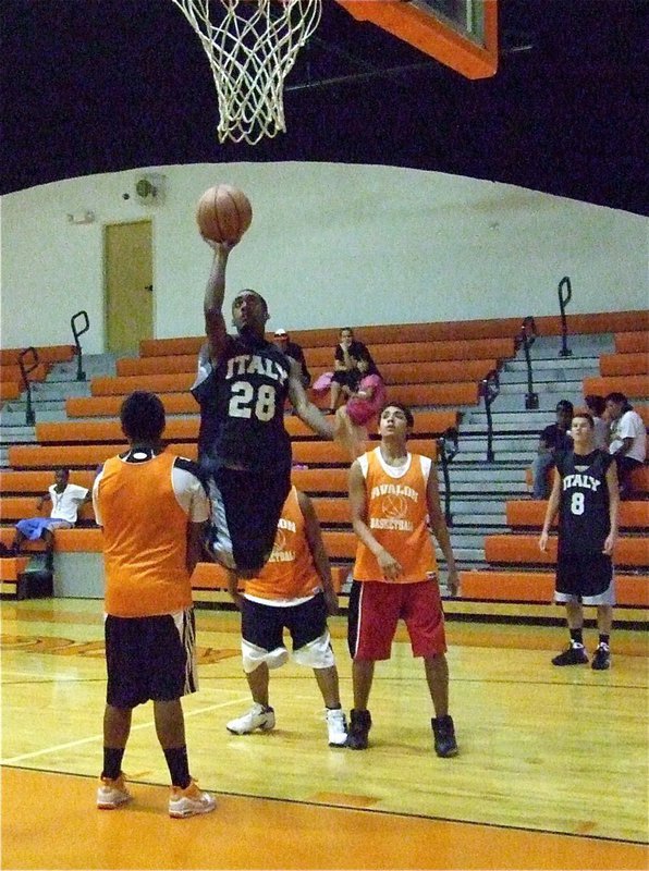 Image: Clemons curves around — Heath Clemons(28) avoids the offensive charge and lays in 2-points.