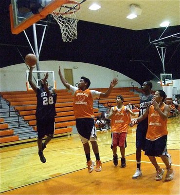 Image: Heath hangs around — Gladiator Heath Clemons(28) hangs in the air for a score.