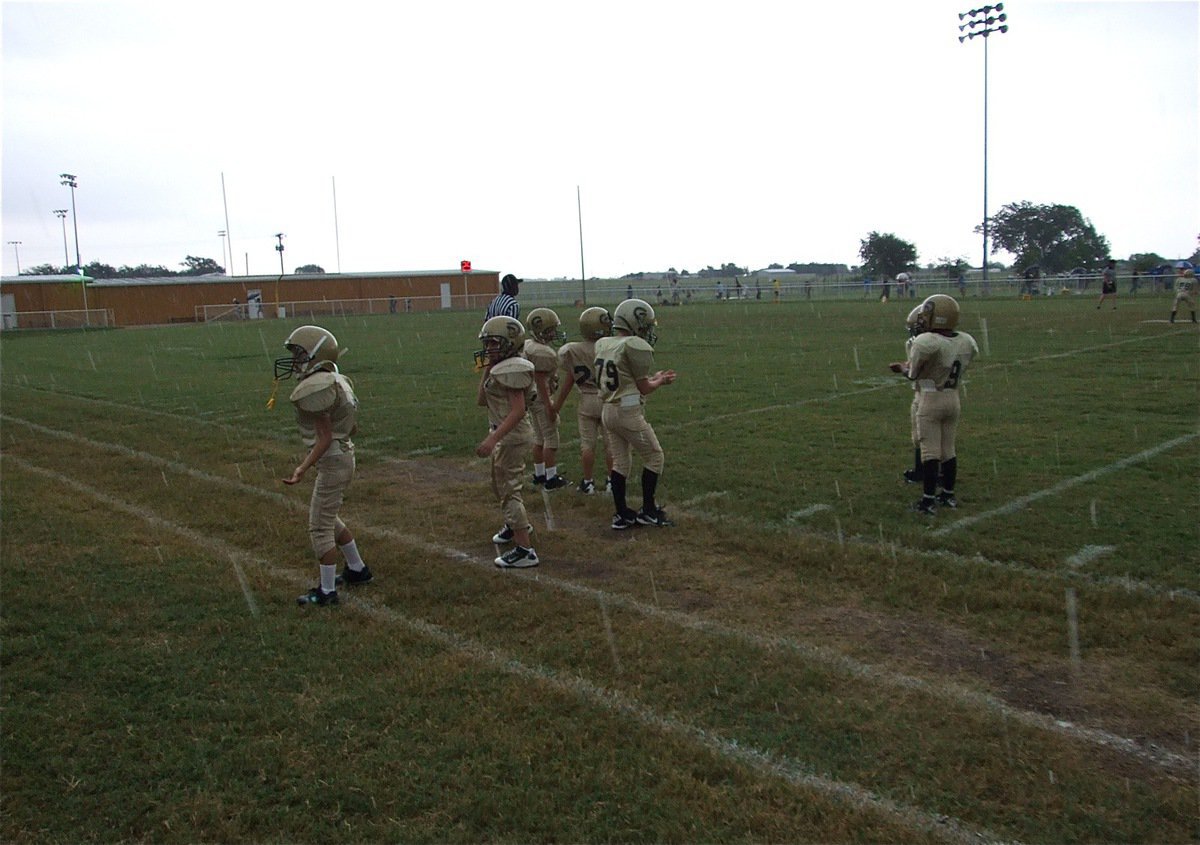Image: Catching some rain — The IYAA Minors were able to finish their game despite increasing rains and held on for a 6-0 victory.