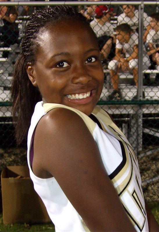 Image: So innocent — K’Breona Davis tries to hide the fact she’s ecstatic that Italy’s JV team beat the Mustangs.
