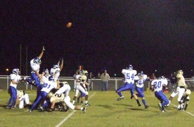 Image: Wortham tries to block — Anderson kicks and scores again.