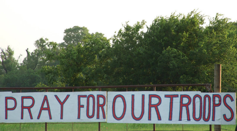 Image: Support for our nation — Church in the Wildwood Ministries hung this sign on the highway for passersby to see and acknowledge.  One person certainly did.
