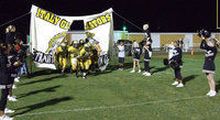 Image: IHS JV team — The IHS Junior High Cheerleaders form the victory line for JV.