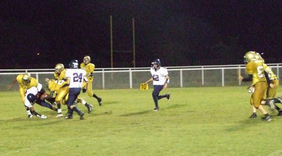 Image: Bringin’ em down — The Gladiator defense playing strong.