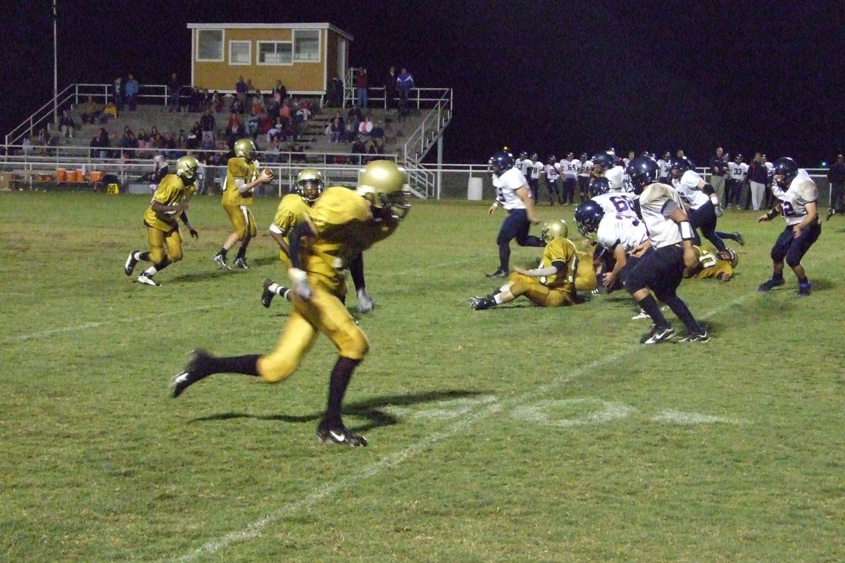 Image: Offensive line gives time — Buchanan searches for the receiver.