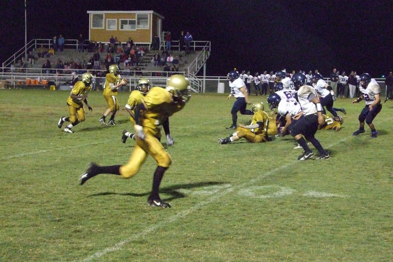 Image: Offensive line gives time — Buchanan searches for the receiver.