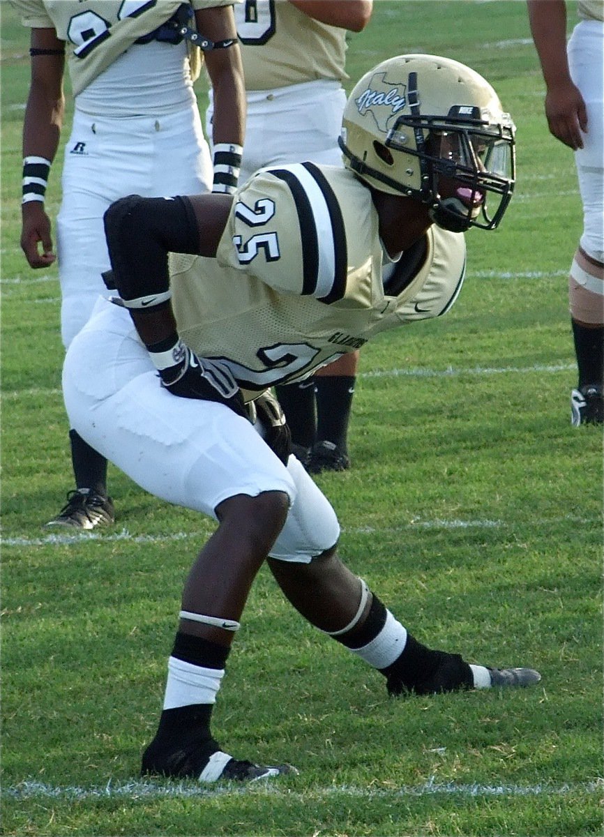 Image: That’s the spot — Corrin Frazier(25) stretches before the game against Mart at Willis Field in Italy.