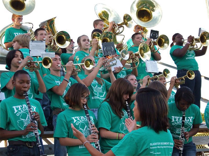 Image: With oomph! — The Gladiator Regiment Band performs the Gladiator School Song before the game as prompted by Drum Major Jessica Hernandez.