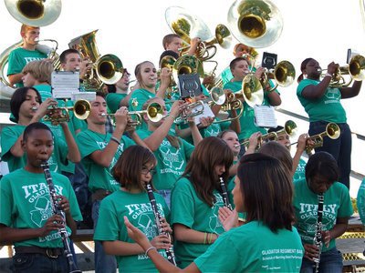 Image: With oomph! — The Gladiator Regiment Band performs the Gladiator School Song before the game as prompted by Drum Major Jessica Hernandez.