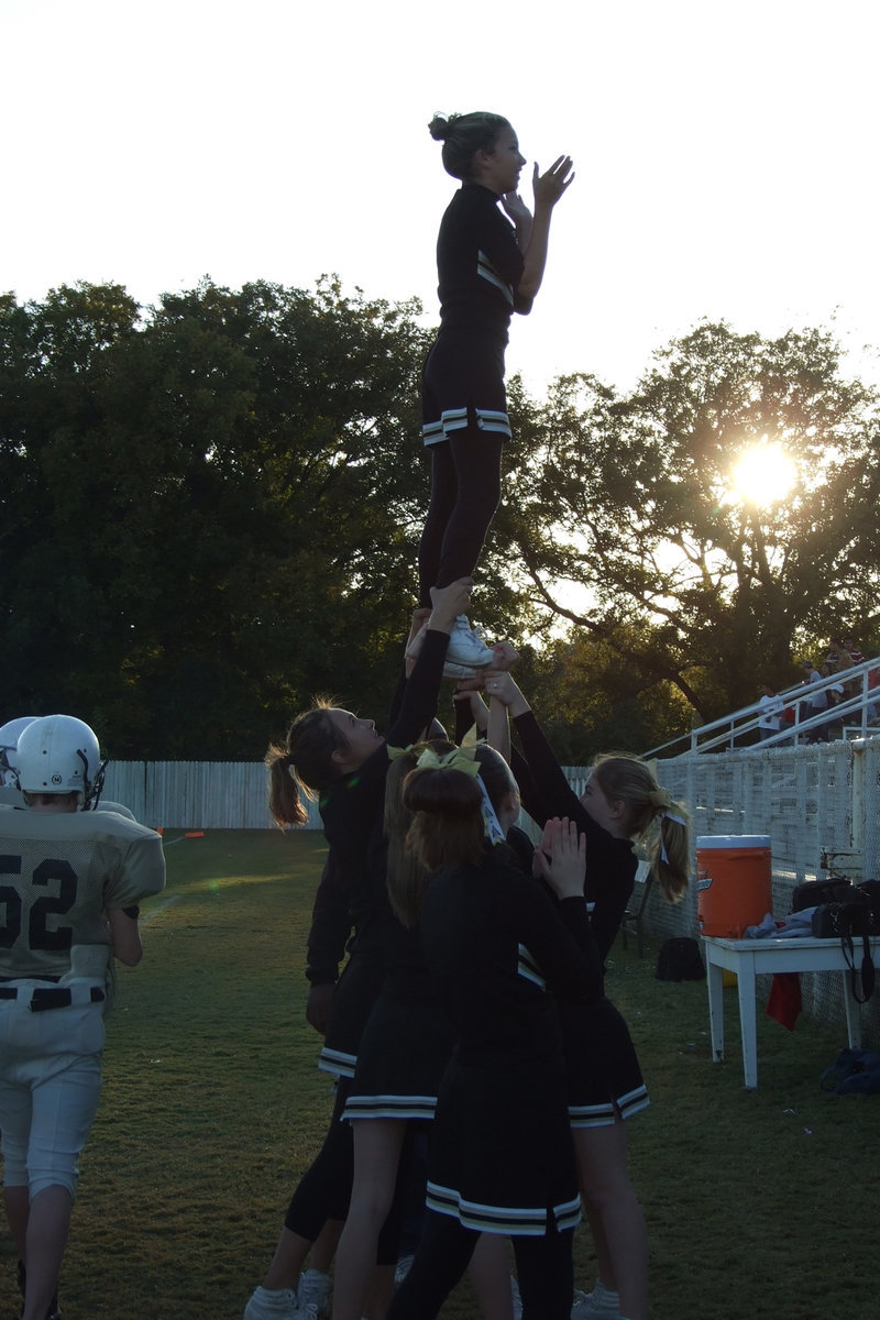 Image: IJH cheerleaders — The cheerleaders stir up spirit in the crowd.