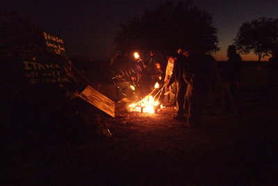 Image: Senior’s torch — Each senior uses the torch they were given to set the fire.