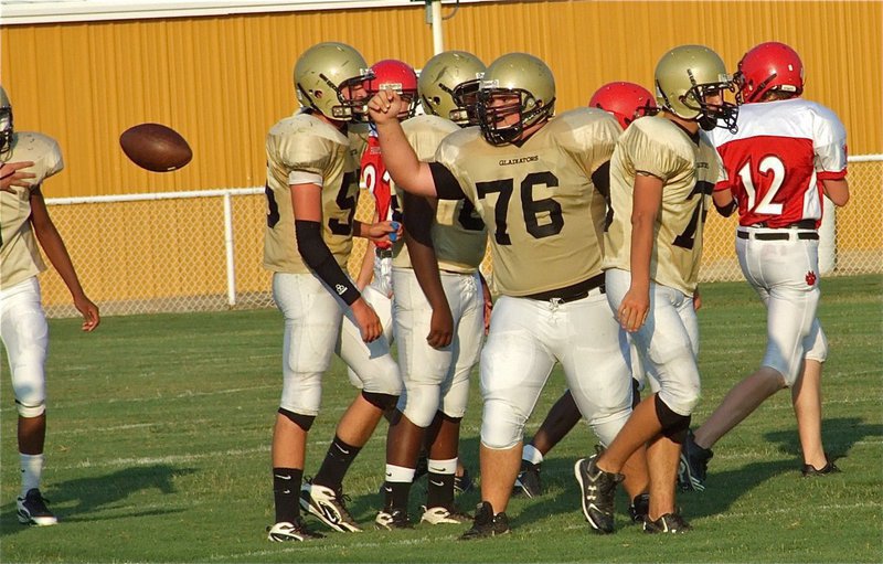 Image: “Big Time” play! — Hank “Big Time” Seabolt(76) makes a big play by recovering a fumble for the JV Gladiators and flips it over to Mr. Referee.