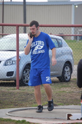 Image: Warm-ups — Jacob Rose warms up for his shot put event.