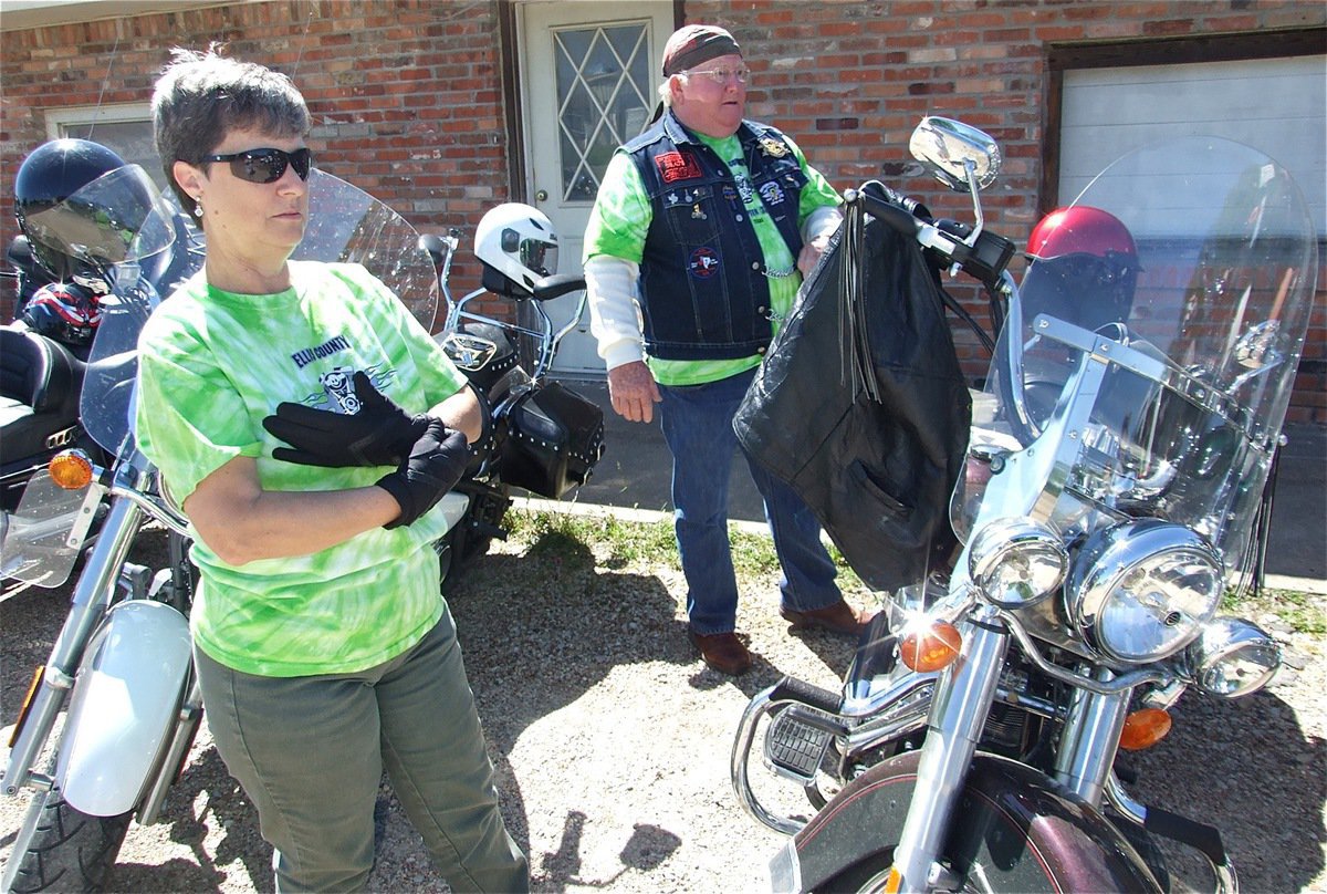 Image: Donna and Earl — Donna and Earl Goodwin, of Italy, get ready to help clear Hwy 77 of debris and discarded trash.