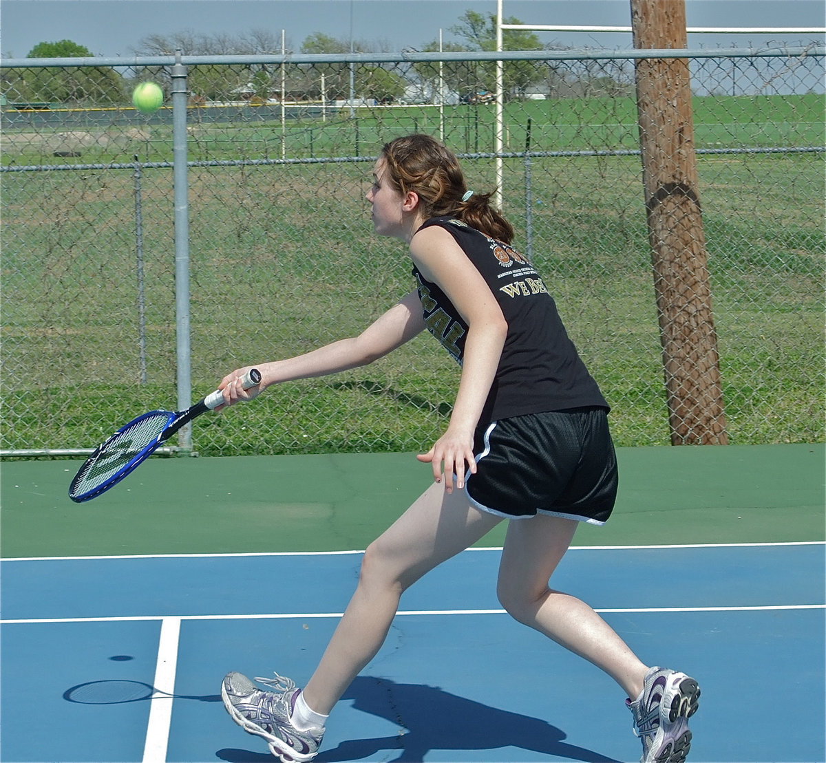 Image: Court diva — Melissa Smithey rushes in to return the ball.