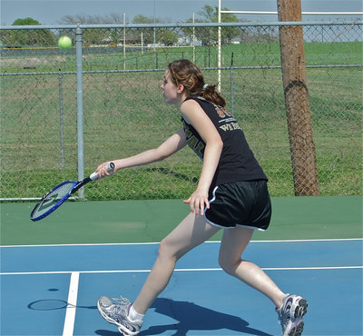 Image: Court diva — Melissa Smithey rushes in to return the ball.