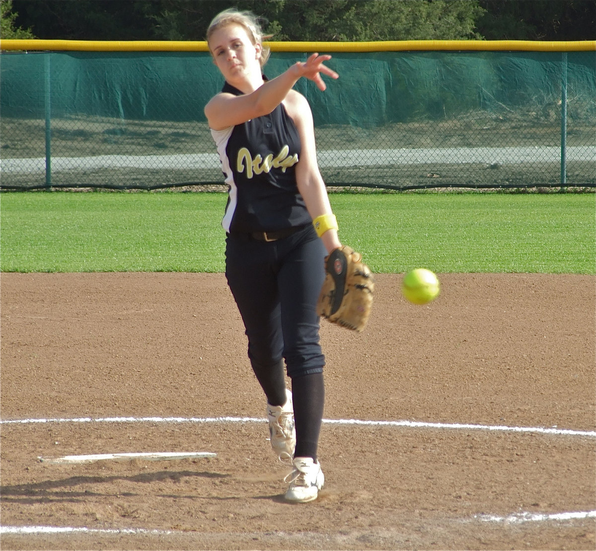 Image: Take this one! — Courtney Westbrook throws the heat.