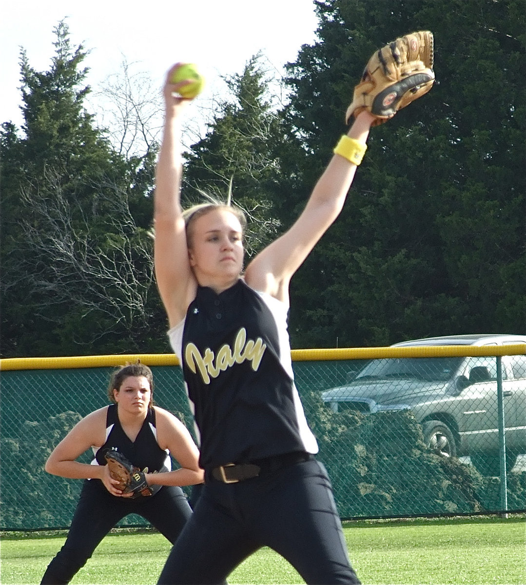 Image: Back support — Second baseman Cori Jeffords has Courtney Westbrooks back as as “Court” comes out of her windup.