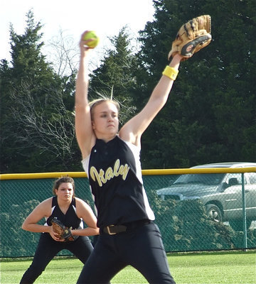 Image: Back support — Second baseman Cori Jeffords has Courtney Westbrooks back as as “Court” comes out of her windup.