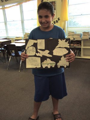 Image: Jasmine Garza — Jasmine is showing us her artwork that she drew by tracing, and free hand drawing. “I had lots of fun.”