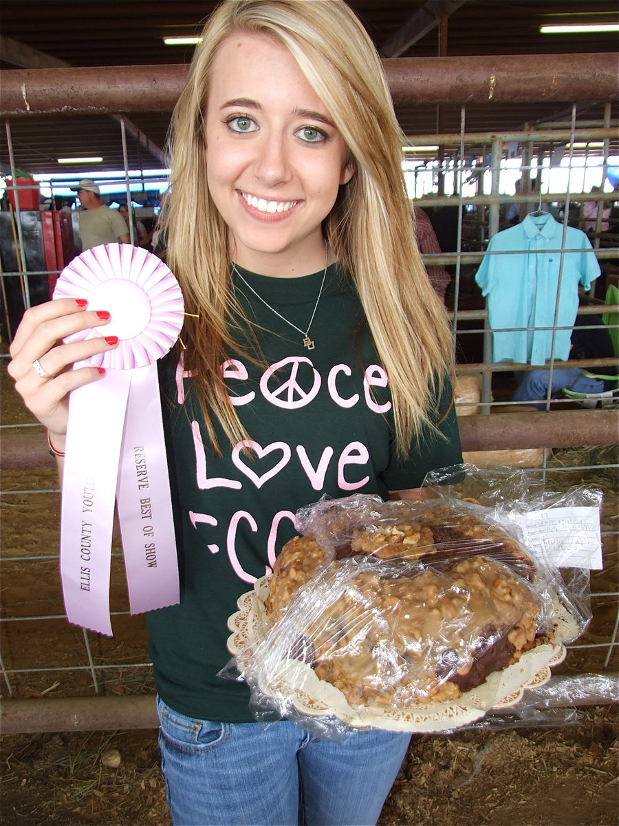 Image: Pretty in pink — Lexie Miller wins a “Reserve Best of Show” pink ribbon for her cake entry as a member of the Italy FCCLA.
