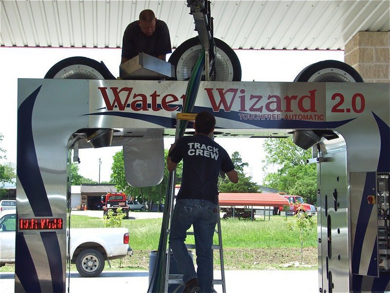 Image: Cleaning crew — C5 Hyles Car Wash owners Christie & Charles Hyles near the end of a 5 year goal that called for installing the Water Wizard in one of his existing bays. Charles even removed some of the previously lain concrete to make the goal a reality.