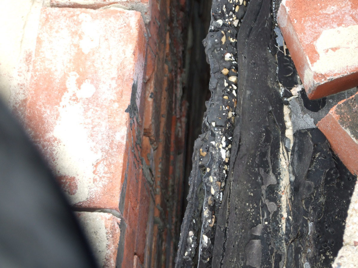 Image: Old Tar Roof — Here you can see how far the wall has pulled away from the old tar roof.