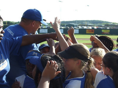 Image: Teamwork, girls — Head Coach Ty Evans reminds the team it takes everyone to win this game.