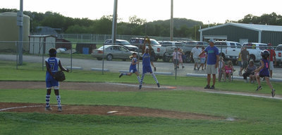 Image: Yeah, she caught it — Jace McIntyre caught this ball easily at first base.  Markia Houston and Gracie Whittington back her up.