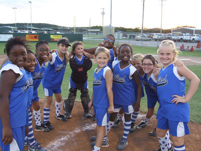 Image: We won, you bet — Milford Lil’ Dogs has one more win under their belt. (L-R) Jenaria Brooks, Alandra Montgomery, Jace McIntyre, Gracie Whittington, Bree Brown, Kieauna Hurtt, Katera Birdow, Alex Jones, Sarah Sanders and Callie Poore.  In the middle are Abbey Evans and Markia Houston.