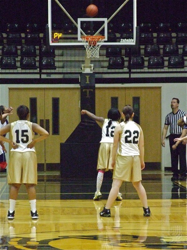 Image: Kendra from the line — Italy 8th grader, Kendra Copeland(12), tries to navigate the ball down into the rim.