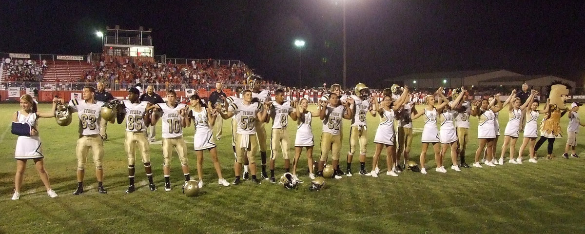 Image: Old Gold and White — Still standing. The Italy Gladiators are ready to stand up to their next opponent.