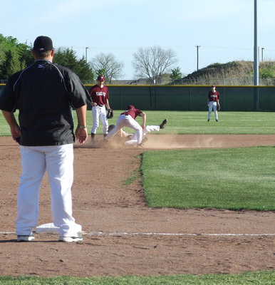 Image: A lot of action — Dan Crownover slid to second.