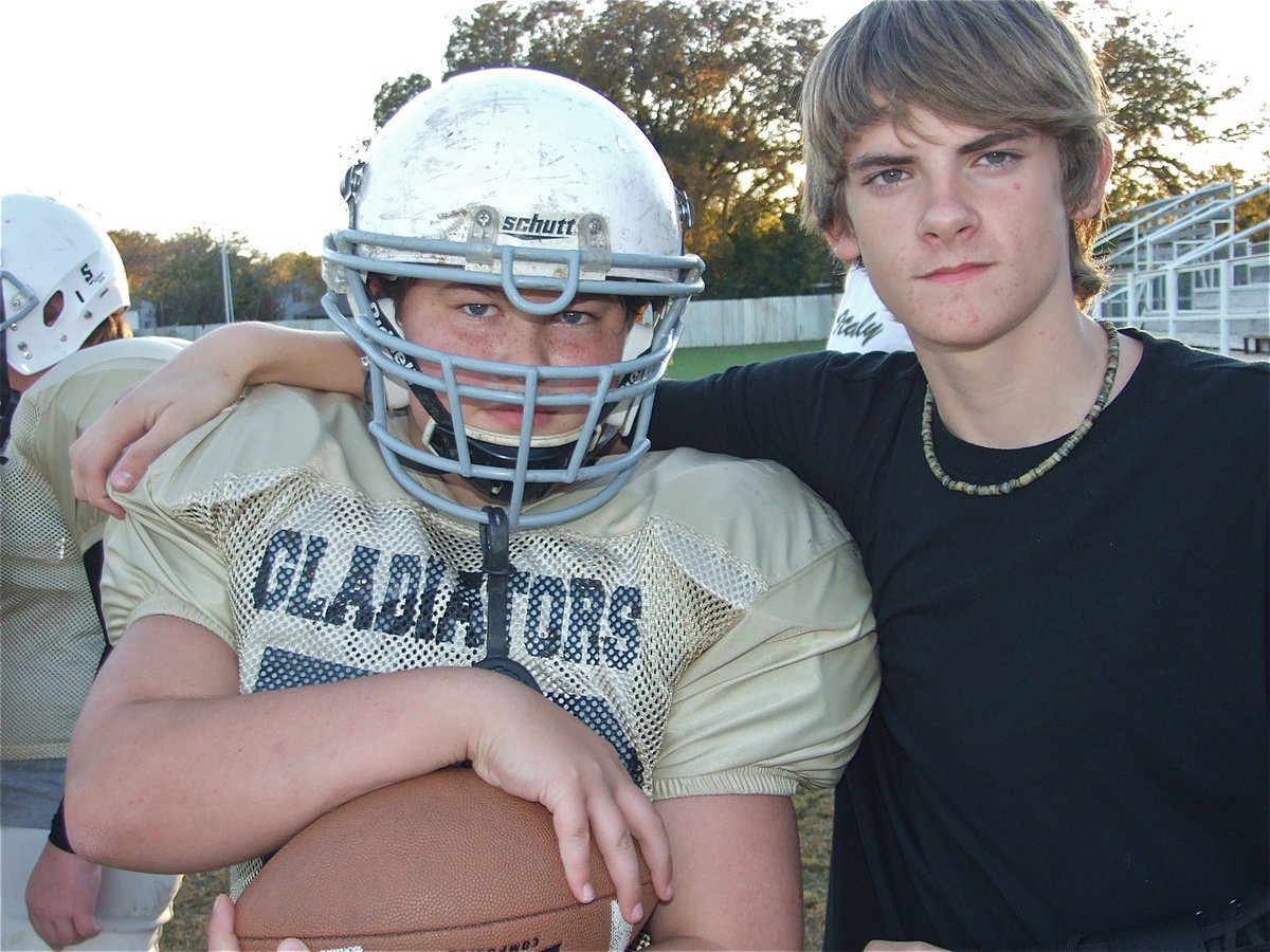 Image: Zain and Justin — Justin Wood is still recovering from a broken left arm he injured during practice before the season began. Zain Byers made it through the whole season this time thanks to duck tape and velcro.