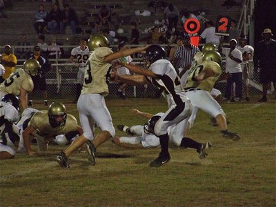 Image: Souder and friends — Defensive end Brandon Souder(63) invited his defensive teammates to a party in Itasca’s backfield.