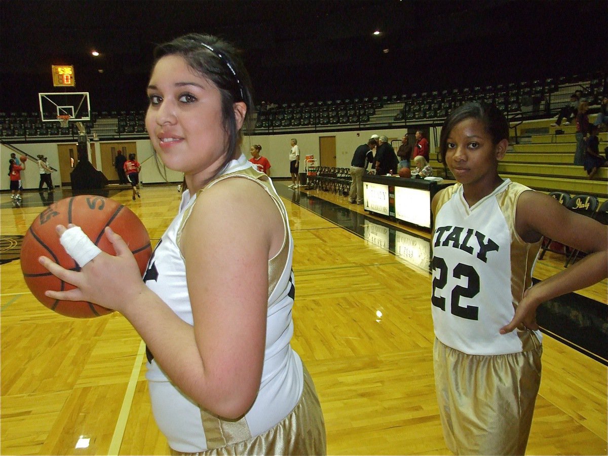 Image: Two tough — Monserrat Figueroa and Bernice Hailey(22) get warmed up before the game against Red Oak Life.