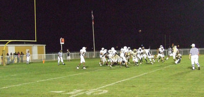 Image: Up and away — Jasenio Anderson kicks the extra point for the Gladiators with Heath Clemons holding. Anderson has made 14 of 23 PATs for 14-points on the season.