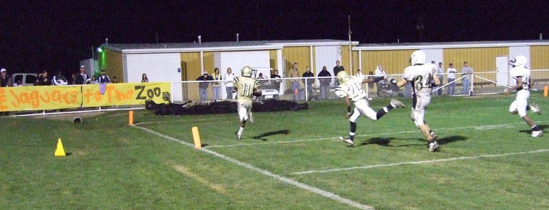 Image: Can’t catch him — Italy quarterback Jasenio Anderson(11) crosses the goal line against the Hubbard Jaguars.