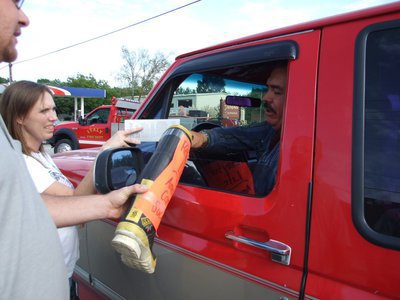 Image: Another donation — Concerned citizen stops to give money to the cause.