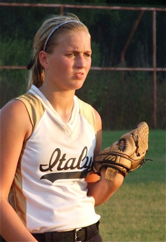 Image: Maddog — Third baseman Madison Washington battles the sun as well as Itasca.