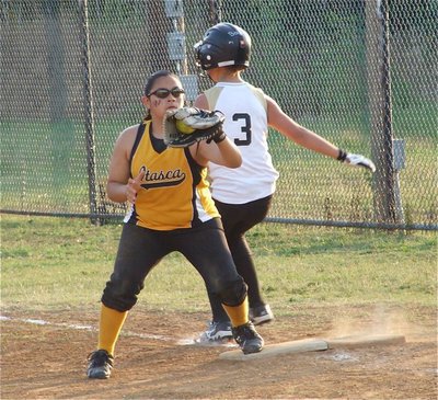 Image: Close play — Itasca made the plays they needed as slap hitter Bailey Eubank can’t quite beat the throw before reaching first base.