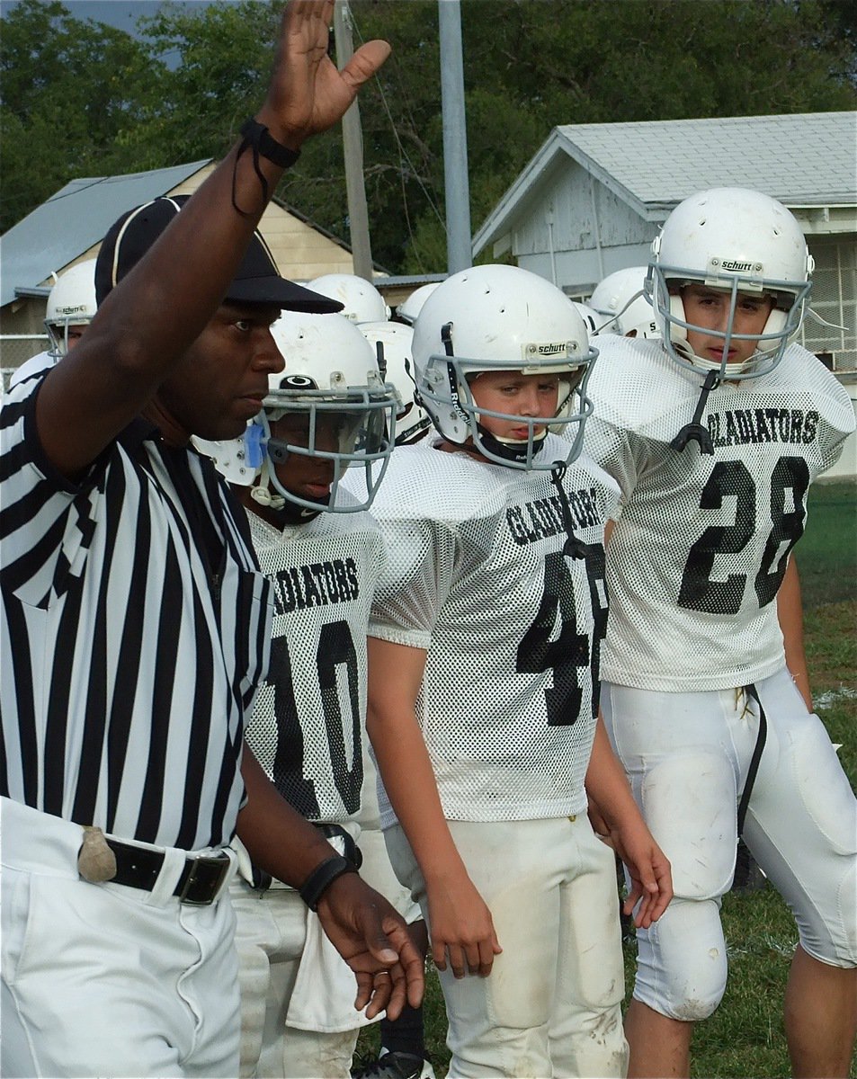 Image: The Italy JH took on Frost in their district opener Thursday. — Eric Carson(10), Bailey Walton(48) and Cody Medrano(28) serve as captains before Italy’s game against the Frost Polar Bears