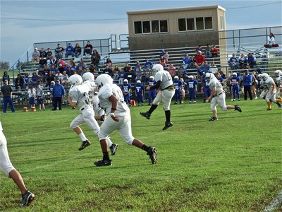 Image: And there’s the kick — Kevin Roldan(64) kicks to Frost to get district underway.