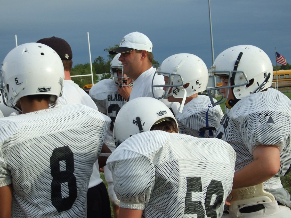 Image: Here we go men — Coaches Josh Ward and Matt Coker get the defense ready to take the field.