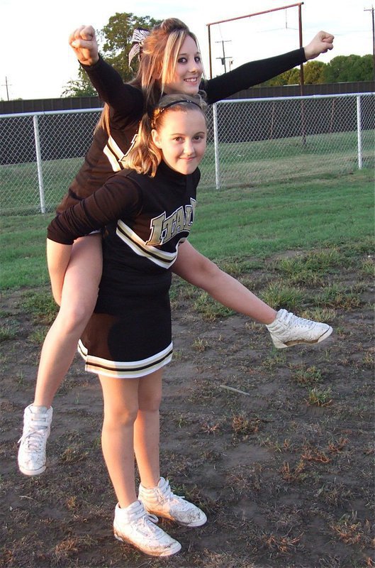 Image: Lifting the spirit — Cheerleaders rely on teamwork.