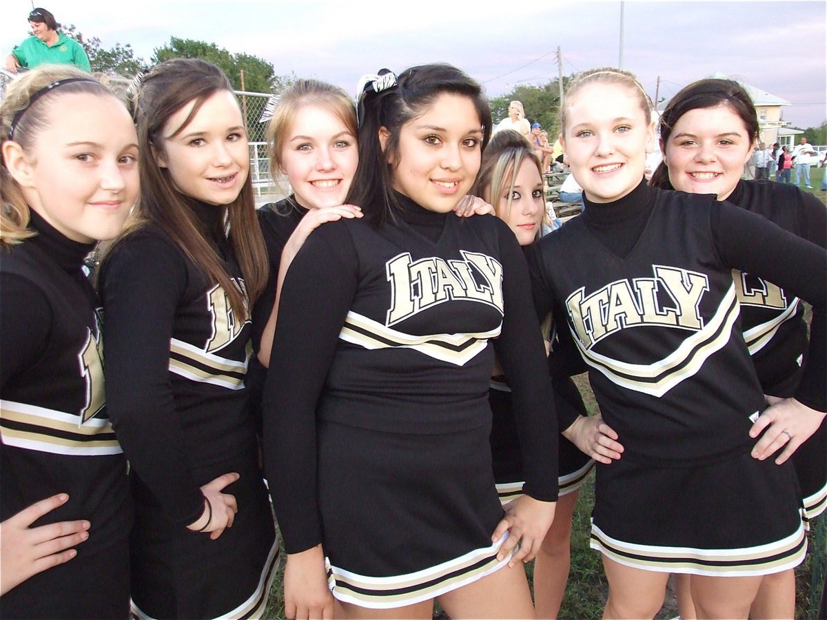 Image: Warm smiles — The Italy Junior Cheerleaders kept warm by cheering on a frosty night.