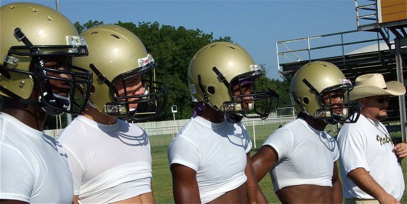 Image: Corrin Frazier, Kyle Jackson, Heath Clemons and De’Andre Sephus stand with Coach Craig Bales.