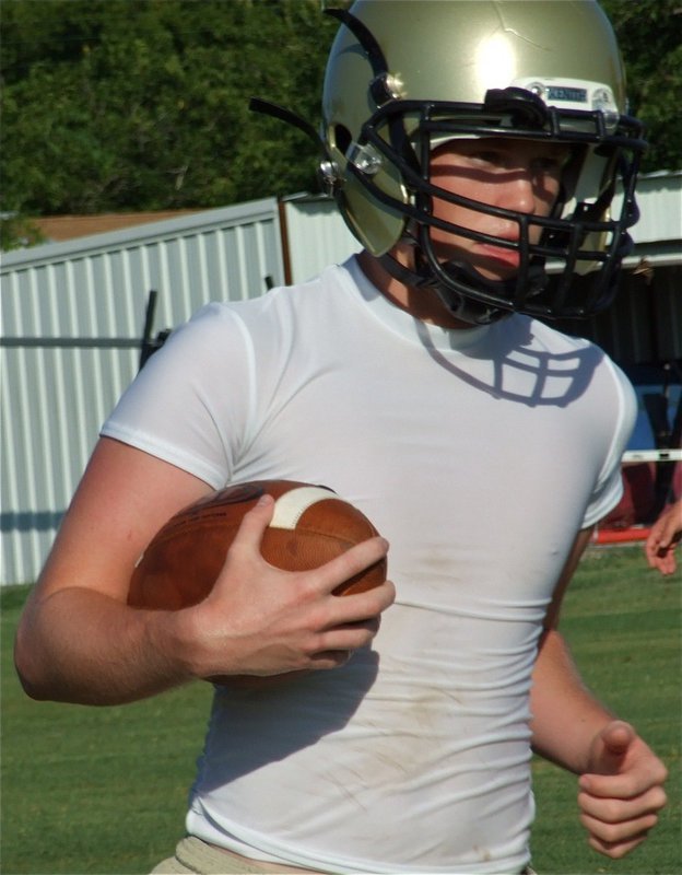 Image: Justin carries — Justin Buchanan can pass it or run it, a double threat guy.