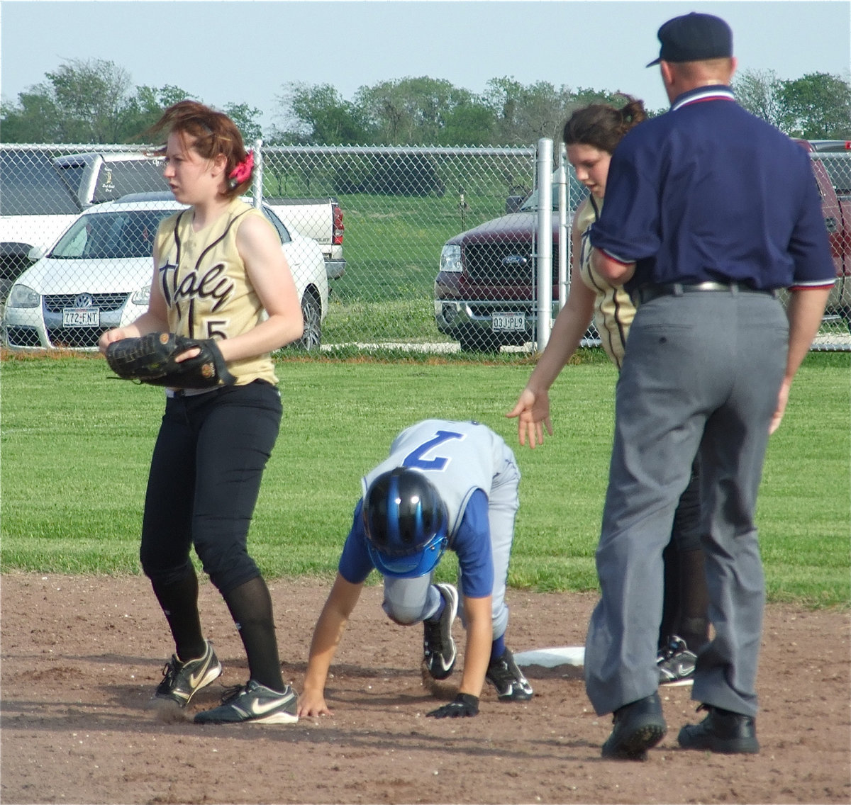 Image: Bear crawl — Center Fielder Bailey Bumpus(5) gets involved in a run down between first and second and tags the Frost runner out.
